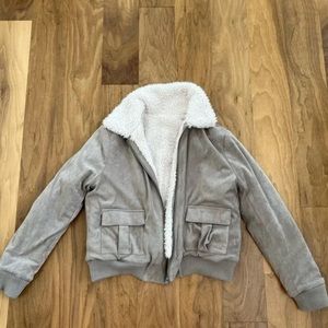 NWT Taupe suede and white sherpa bomber. Pockets on both sides - size XS